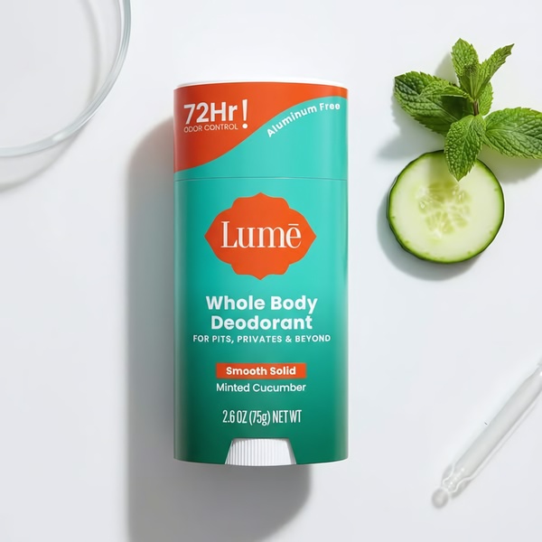 A clean, high-contrast studio shot of a Lumē deodorant stick positioned alongside fresh mint and cucumber, emphasizing natural ingredients and key benefits.