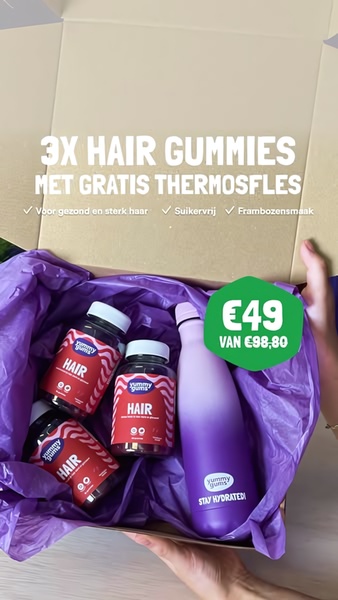 A top-down, first-person perspective of an open box containing three bottles of hair gummies and a branded thermos, featuring a clear discount offer.