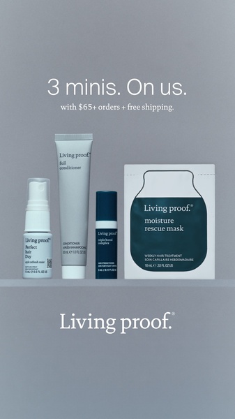 A clean, minimalist product display of four hair care samples on a neutral gray background, highlighting a gift-with-purchase offer.