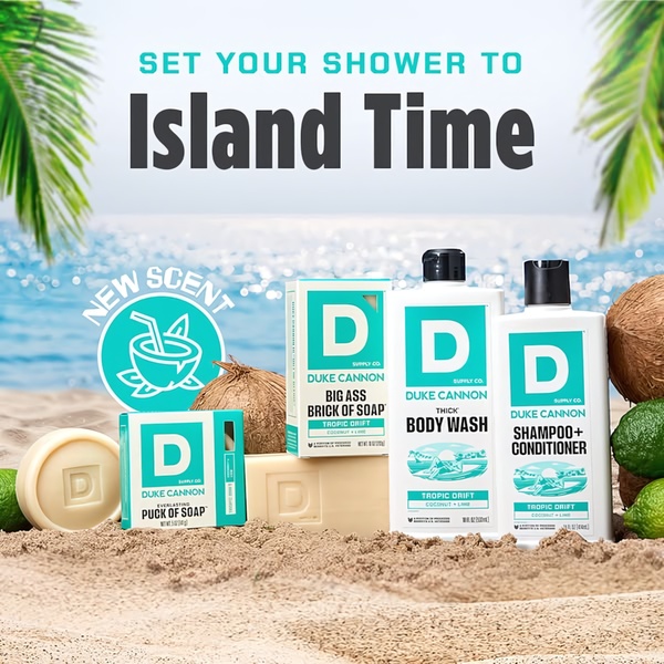 A high-contrast, beach-themed product shot showcasing a full line of coconut and lime scented grooming products placed on sand.