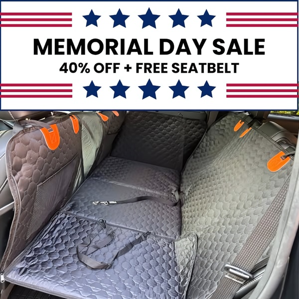 A square-format static ad featuring a dog car seat cover with a Memorial Day sale offer and star-spangled design elements.