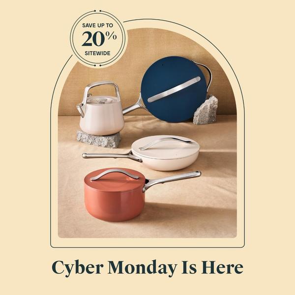 A clean, studio-lit display of a ceramic cookware set featuring a discount offer for a Cyber Monday promotion.