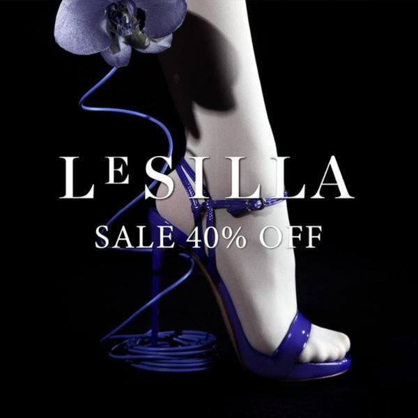A high-fashion, minimalist product advertisement for high heel sandals showcasing a dramatic, dark-themed visual with a 40% off sale headline.