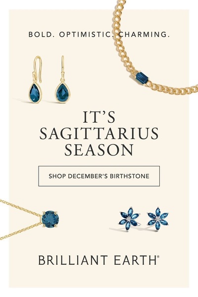 A seasonal product-focused ad featuring blue gemstone jewelry pieces displayed on a clean, light background with elegant typography.