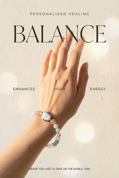 A high-contrast, minimalist shot of a hand wearing a beaded bracelet against a neutral, soft-focus background.