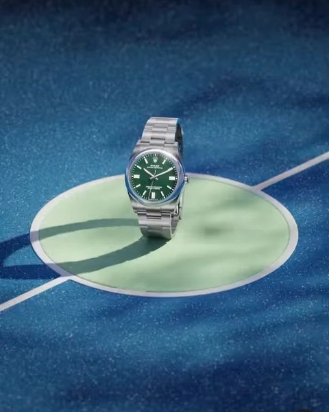 wrist watch, analog watch, metal watch, steel watch, luxury watch, brand awareness, minimalist, editorial, luxurious, calm, blue, green, neutral