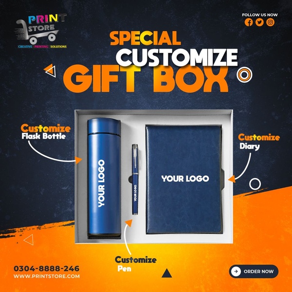 A clean, studio-lit display of a customized flask, pen, and diary set, designed to showcase personalization services for corporate clients.