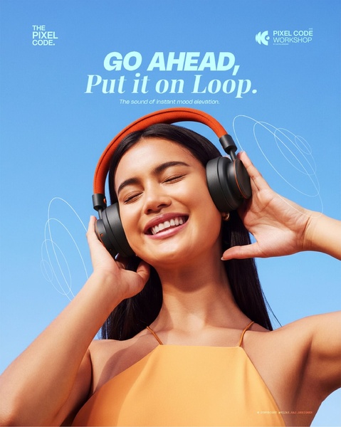 A close-up lifestyle shot of a smiling person wearing headphones, conveying a feeling of joy and musical immersion.