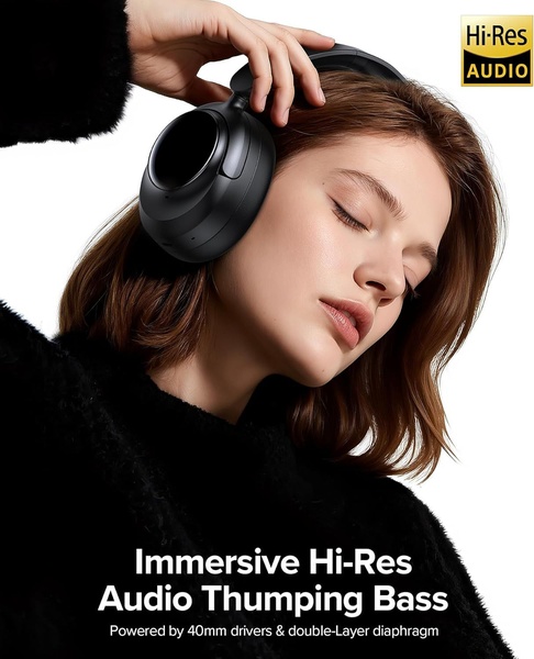 A close-up studio shot of a person with eyes closed wearing premium black over-ear headphones, highlighting the Hi-Res audio experience.