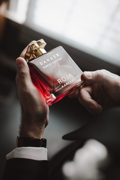 mens cologne, parfum, fragrance bottle, perfume, scent, brand awareness, lifestyle, editorial, luxurious, bold, neutral, red, gold