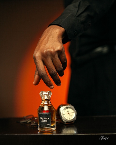 mens cologne, perfume bottle, fragrance, scent, eau de parfum, brand awareness, lifestyle, editorial, luxurious, bold, black, orange