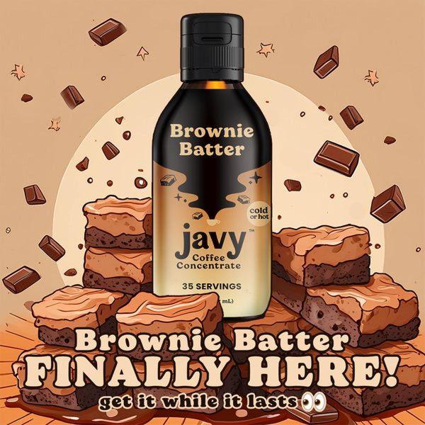 This ad features a central product shot of a brownie-flavored coffee concentrate surrounded by floating brownie chunks to emphasize flavor and texture.