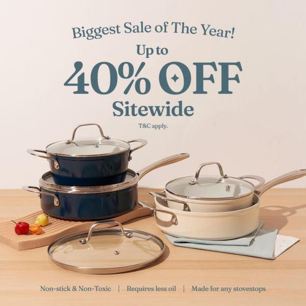 A clean, studio-lit display of a ceramic cookware set accompanied by a bold, typography-led offer of 40% off sitewide.