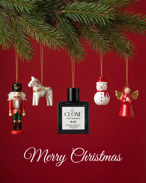 A high-quality studio shot of a perfume bottle hanging from a pine branch alongside traditional Christmas ornaments.