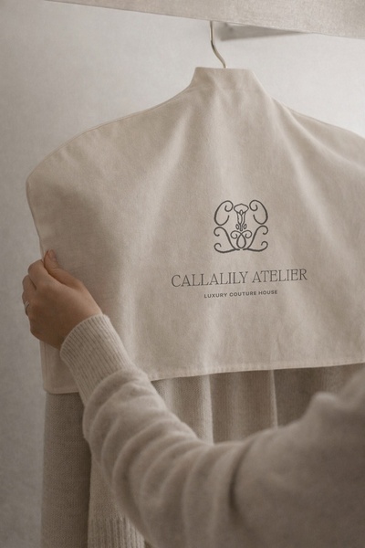garment bag, clothing cover, dress bag, suit cover, protective bag, brand awareness, lifestyle, minimalist, luxurious, calm, neutral