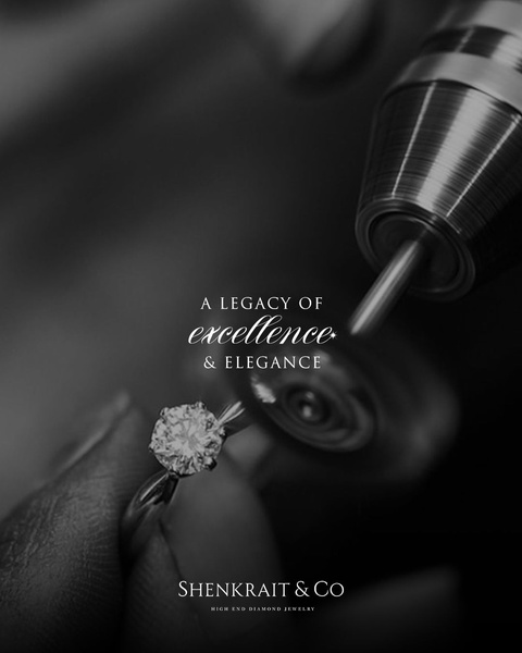 A close-up, black and white shot of a diamond ring being polished by a professional, highlighting craftsmanship and luxury.