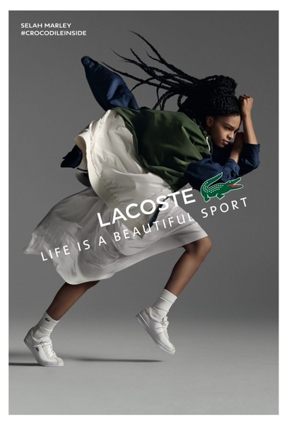 A high-fashion, athletic-inspired shot of a model mid-jump wearing casual sneakers, emphasizing fluid movement and brand lifestyle.