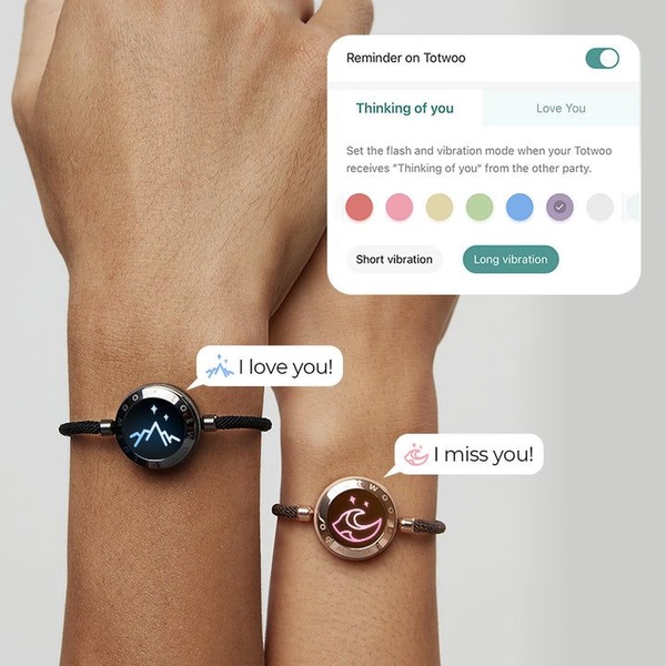A close-up demonstration showing two people wearing connected bracelets with an overlaid UI element explaining vibration and color-coded communication modes.