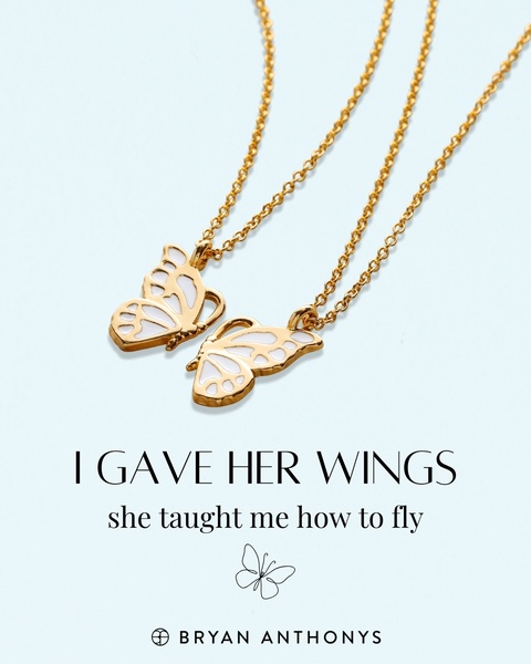 A minimalist, high-quality image of two gold butterfly necklaces against a soft blue background, using an emotional, relationship-focused hook.