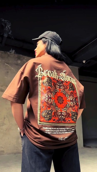 graphic t-shirt, short sleeve shirt, crew neck tee, printed t-shirt, oversized t-shirt, brand awareness, lifestyle, bold, brown, red, black