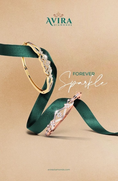 A high-end, elegant studio shot featuring two gold and rose gold bracelets elegantly wrapped with a green silk ribbon.