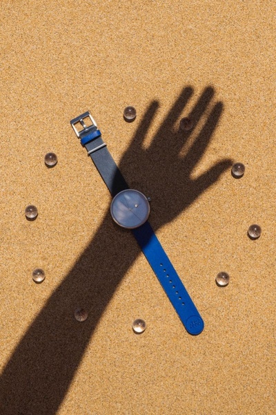 wrist watch, analog watch, leather strap watch, blue watch, mens watch, brand awareness, minimalist, calm, luxurious, brown, blue