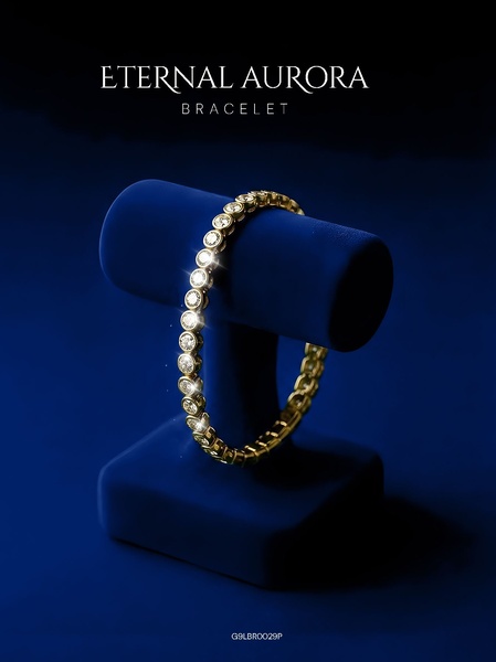 A high-end product hero shot featuring a gold bracelet on a dark blue velvet stand with dramatic lighting to emphasize sparkle.