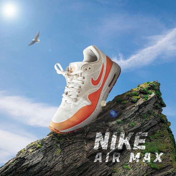 A high-contrast hero shot of a running shoe perched atop a rugged mountain peak against a clear sky to signal performance and freedom.
