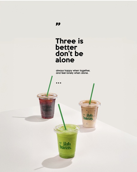 A minimalist studio shot featuring three cups of iced beverages arranged in a triangular composition with a clean, high-key background and a short, evocative headline about companionship.
