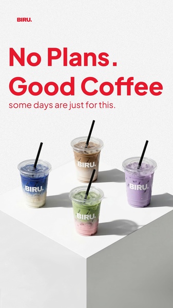 Four iced coffee cups are arranged in a minimalist setting on a white block against a white wall.