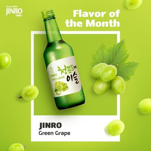 A crisp, high-contrast product hero shot featuring green grape soju surrounded by fresh grapes on a monochromatic green background.