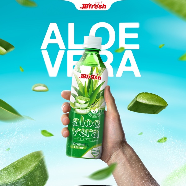 A close-up, high-energy product shot of an aloe vera drink held against a bright, refreshing blue background with floating aloe slices.