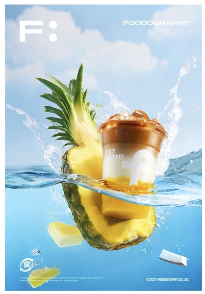 A high-quality product shot featuring a coffee cup submerged in water with pineapple, highlighting refreshing ingredients and cool tones.