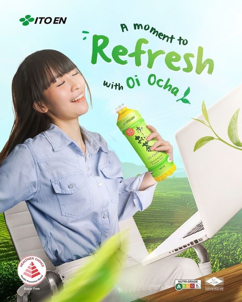 A high-quality lifestyle image of a woman happily drinking green tea while working on a laptop, set against a vibrant green tea plantation background.