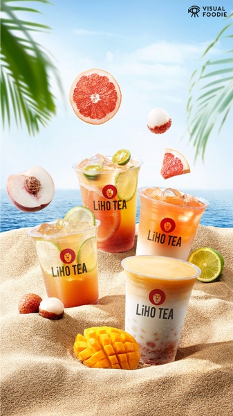 A visually refreshing advertisement featuring multiple fruit tea cups on a beach with floating fresh fruit ingredients.