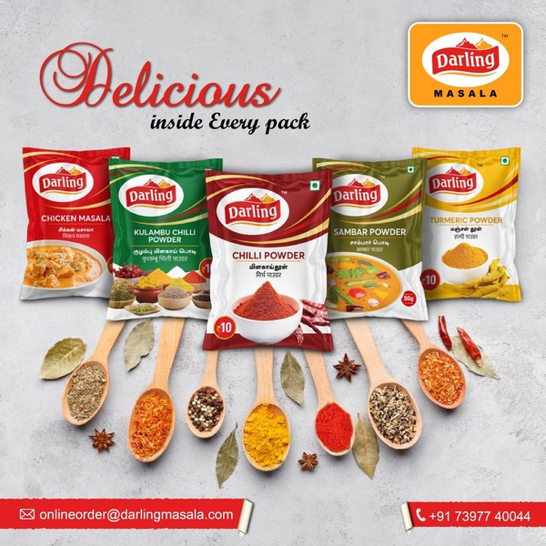 A flat-lay style product hero creative featuring five distinct spice pouches surrounded by raw ingredients in wooden spoons on a neutral surface.