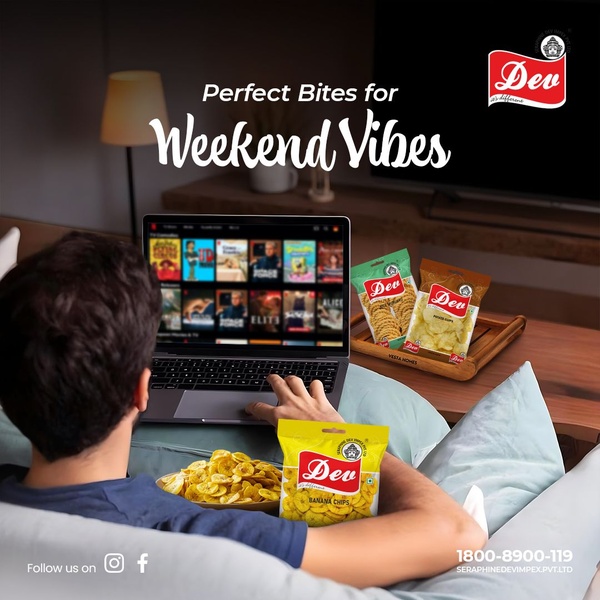 A lifestyle shot showing a person relaxing on a sofa with a laptop, featuring three packages of snack chips positioned on a wooden tray.