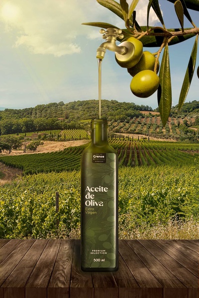 A surreal and premium product shot featuring a brass faucet pouring fresh olive oil directly from a tree branch above a bottle set in a lush Mediterranean landscape.
