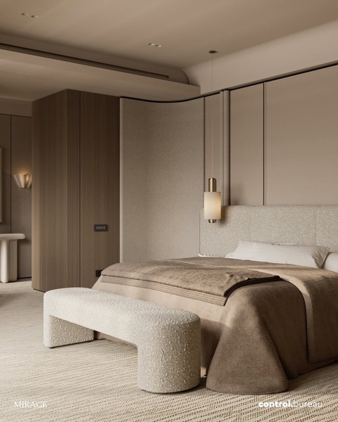 A sophisticated, high-end bedroom shot featuring a textured upholstered bench at the foot of a bed, emphasizing a serene, monochromatic aesthetic.