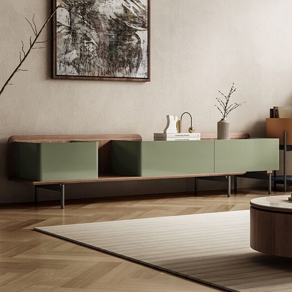A sophisticated lifestyle shot of a modern, multi-toned TV console unit placed in a clean, high-end living space.