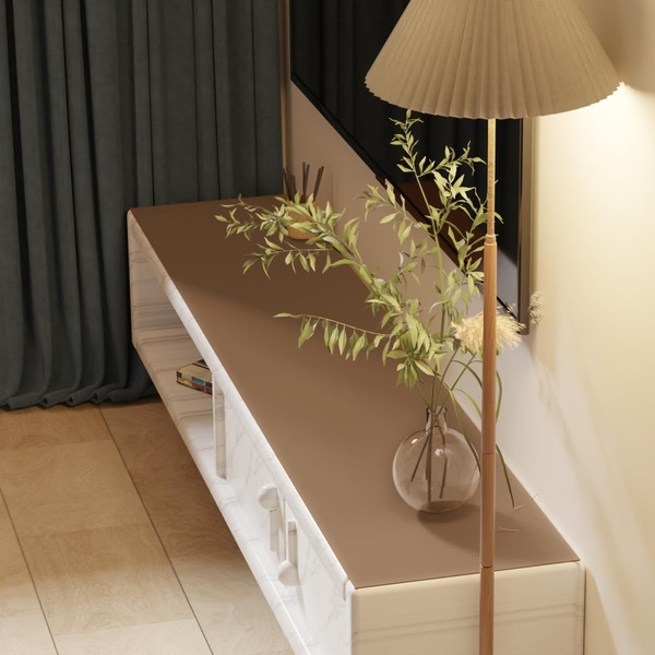 A high-angle product shot of a marble TV console featuring soft, warm lighting and sophisticated interior styling.