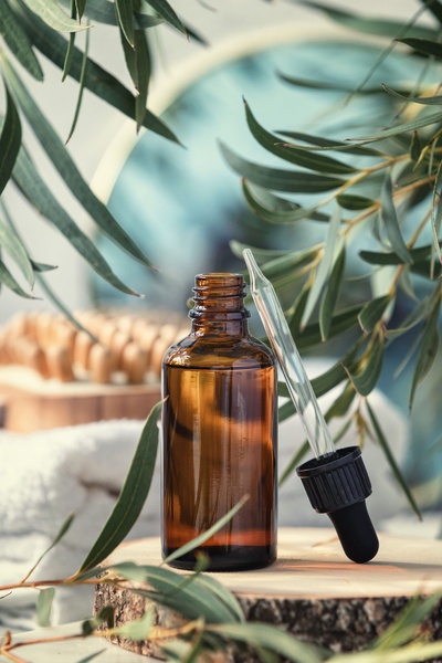 face oil, serum bottle, dropper bottle, essential oil, skincare serum, brand awareness, lifestyle, minimalist, calm, fresh, neutral, green, brown