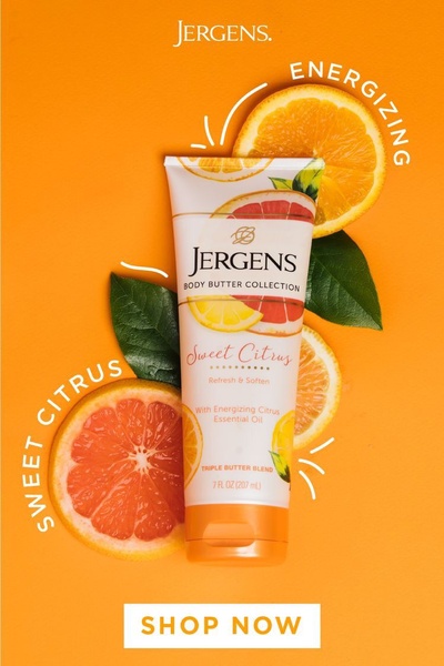 A high-contrast, vibrant hero shot of a body butter tube surrounded by fresh grapefruit and orange slices to convey natural refreshment.
