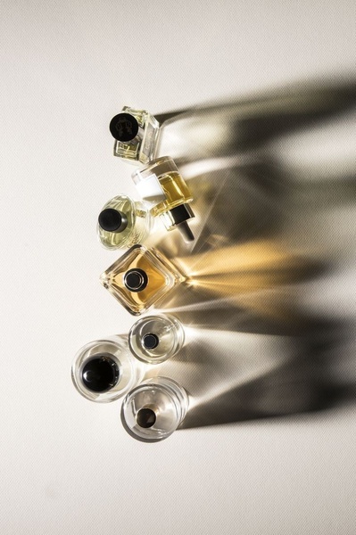 perfume bottles, fragrance collection, scent bottles, perfume vials, glass perfume bottles, bestseller push, minimalist, flat lay, calm, luxurious, neutral