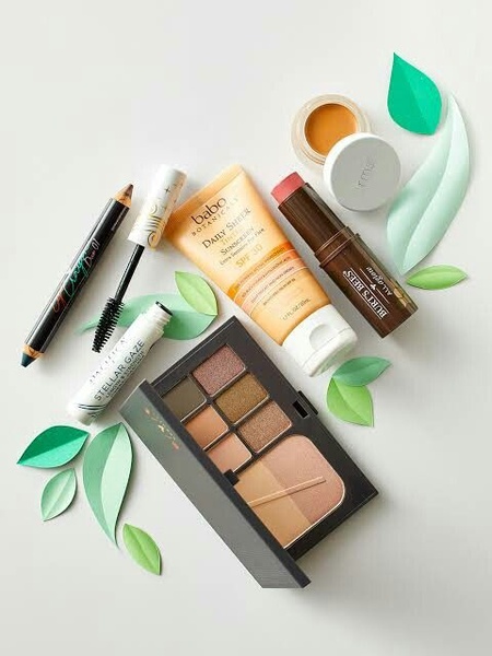 makeup palette, sunscreen tube, mascara wand, lipstick stick, eyeliner pencil, cosmetic cream, bestseller push, flat lay, minimalist, fresh, calm, neutral, green