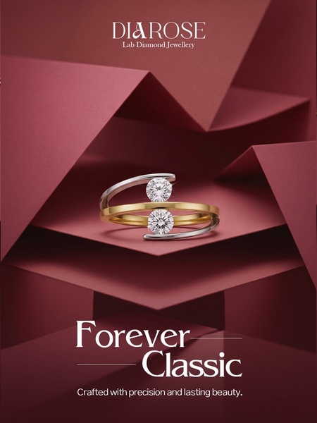 A high-end, minimalist presentation of a two-tone diamond ring set against a structured, deep red geometric background.