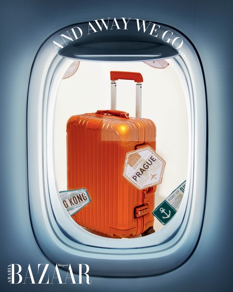 A high-end orange suitcase is positioned as if inside an airplane cabin window, evoking the luxury of global travel.