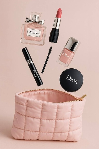 This creative showcases a curated set of high-end beauty products suspended in mid-air above a matching quilted makeup bag, creating a clean and aspirational aesthetic.