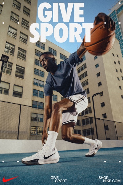 An action-oriented, low-angle shot of a basketball player performing a jump shot on an urban outdoor court.