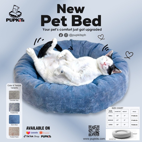 A clean, square-format ad showcasing a new pet bed with a sleeping cat, featuring color variants, a detailed size chart, and platform availability.